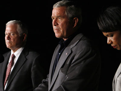 President Bush, accompanied by Robert Gates and Condoleeza Rice, makes a statement to reporters at Al-Asad Airbase in Anbar province, Iraq, on Sept. 3, 2007. (AP/Charles Dharapak)