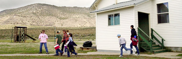 Students leave the gymnasium/cafeteria building at Adel Middle School in Adel, Oregon. Rural schools face an achievement gap that can be narrowed with additional learning opportunities. (AP/Don Ryan)