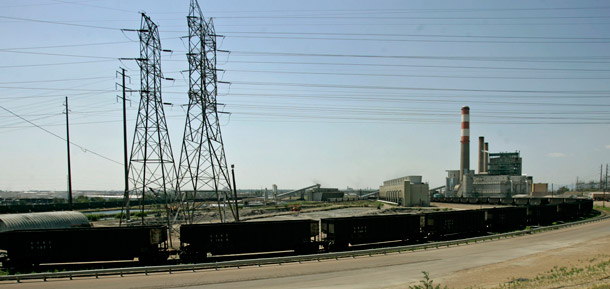 Coal cars surround the Xcel Energy conventional power plant near Denver. The Climate Security Act would create a cap-and-trade program to reduce greenhouse gas emissions from plants like this. (AP/Ed Andrieski)