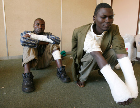 Supporters of Zimbabwe's Movement for Democratic Change opposition party show their injuries, which they say were sustained during attacks by members of ZANU-PF militia, in Harare, on May 3, 2008. (AP)