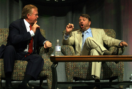 CNN's Lou Dobbs talks with former Foreign Minister of Mexico Jorge Castaneda about immigration at the National Association of Hispanic Journalists luncheon in 2006. Dobbs often highlights crimes committed by illegal immigrants on his program. (AP/Luis M. Alvarez)