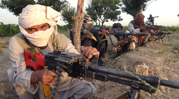 Masked Taliban militants pose at a defensive position at a undisclosed in Ghazni province, Afghanistan last weekend. More than 2,300 people have died in insurgency-related violence this year, according to an Associated Press tally of official figures. (AP/Rahmatullah Naikzad)