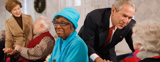 President Bush and first lady Laura Bush, greet residents, from left, Carl Bergquist, Lelia Bishop, and Rita Pauly during their visit to the Little Sisters of the Poor, a charity which cares for the elderly. (AP/Charles Dharapak)