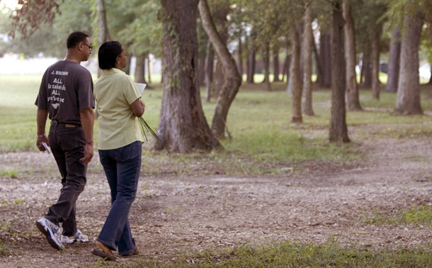 A couple walks on a recently dedicated nature trail in Houston, TX. Walking provides many benefits, but there must be an effort to make cities more walk-friendly. (AP/Chronicle, Brett Coomer)