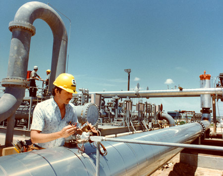 A technician inspects a gauge on a meter station at the Strategic Petroleum Reserve's Bryan Mound site near Freeport, TX. Selling a half million barrels of oil per day from the reserve would increase supply and reduce prices. (AP/Energy Department)