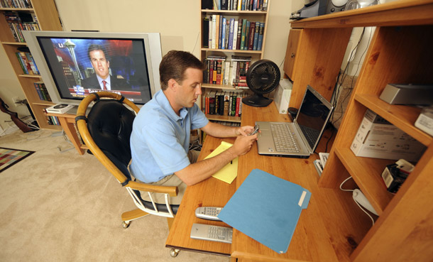 Brent Cranfield telecommutes from his home in Marietta, GA, on May 29, 2008. By telecommuting one day a week, Cranfield saves 30 to 40 miles in driving. (AP/Stanley Leary)