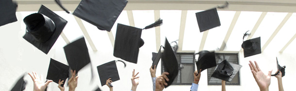 Students fling their caps at the end of their graduation ceremony. (AP/Mahesh Kumar A)