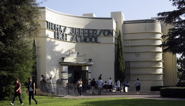 Students wait outside Jefferson High School in Los Angeles for class to start on August 6, 2008. Jefferson's dropout rate is currently 58 percent. There are several federal policies that can counter stagnating graduation rates, such as early college high schools. (AP/Nick Ut)