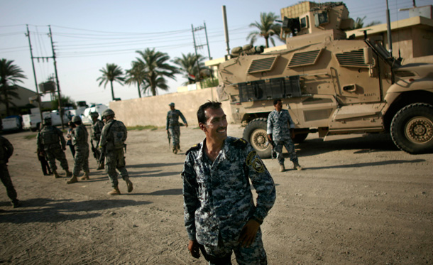 A commander in the Iraqi National Police stands in front of a local police station near Khanaqin. (AP/Marko Drobnjakovic)