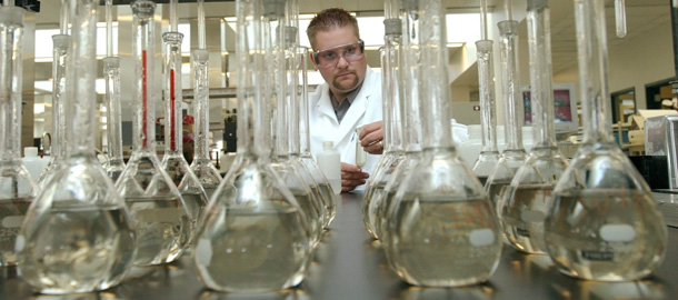 An air quality chemist for the South Coast Air Quality Management District tests samples to determine pollution levels and the specific components of pollution. (AP/Rene Macura)