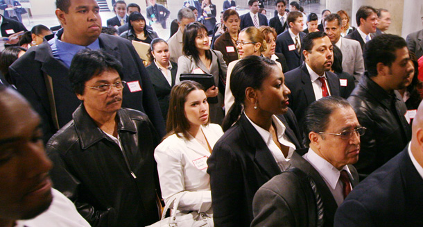 Job seekers crowd into a job fair at the Jacob Javits Convention Center in New York sponsored by the Hispanic Alliance for Career Enhancement. (AP/Mark Lennihan)