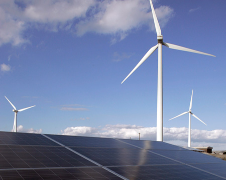 Large windmills and solar panels in Atlantic City; the wind farm consists of five windmills that generate 7.5 megawatts, enough energy to power approximately 2,500 homes. (AP/Mel Evans)