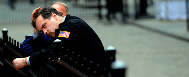 A trader takes a break as the Dow Jones Industrial plummeted, Monday, September 29, outside the New York Stock Exchange. (AP/Stephen Chernin)