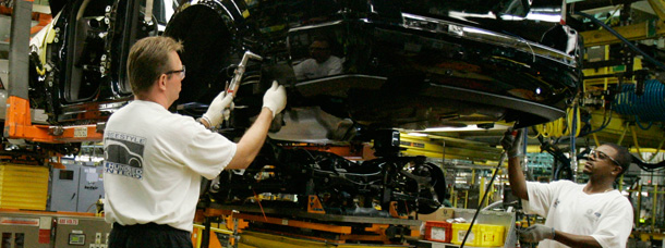 Ford employees assemble cars at the automaker's Chicago plant. Overall employment in the United States declined 159,000 jobs in September. (AP/Spencer Green)