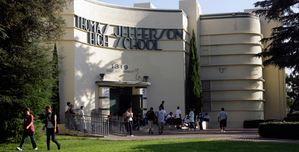 Students wait outside Jefferson High School in Los Angeles. With a 58 percent dropout rate, Jefferson has the worst record in the Los Angeles Unified School District, which averages 33.6 percent dropouts. (AP/Nick Ut)