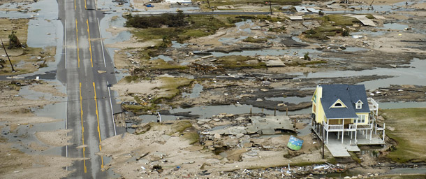 Damage from Hurricane Ike in Gilchrist, Texas, on September 14, 2008. While taking action was necessary to deal with the financial crisis, continued inaction on the climate crisis will lead to severe and irreversible damage. (AP/Smiley N. Pool)