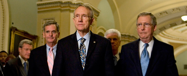 Senate Majority Leader Harry Reid leads Senate leaders to a news conference following the passage of the Senate version of the bailout package by a vote of 74-25. (AP/Evan Vucci)