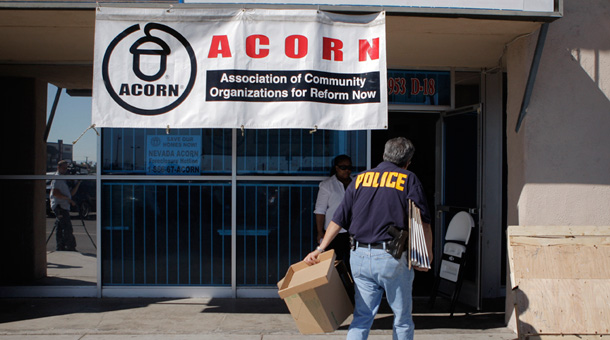 An investigator enters the ACORN office in Las Vegas this week after allegations of voter fraud were filed. (AP/Jae C. Hong)