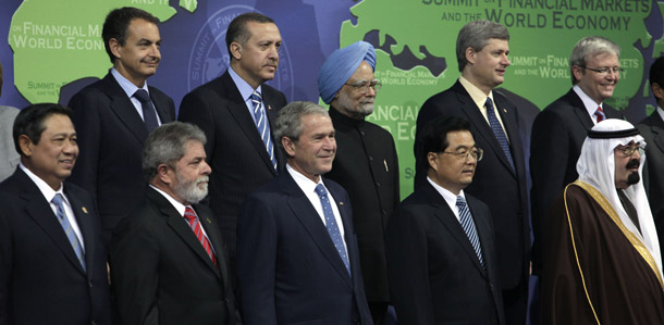 President George W. Bush and other world leaders pose for a group photo on November 15, 2008, in Washington, at the Summit on Financial Markets and the World Economy. While leaders reached consensus on several issues concerning financial markets, more action is needed to help the world's poor and most vulnerable. (AP/Evan Vucci)