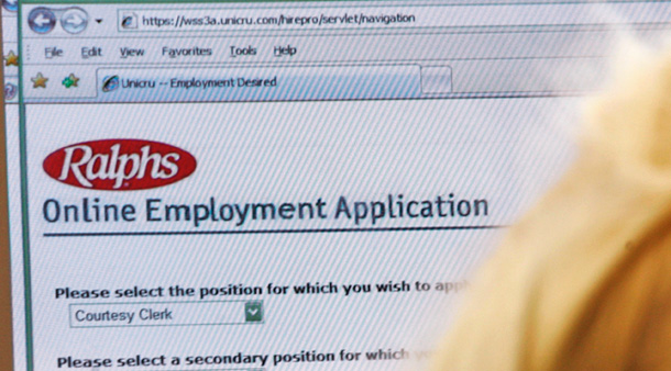 A jobseeker fills out an online employment application. The U.S. economy lost 240,000 jobs in October 2008. (AP/Reed Saxon)
