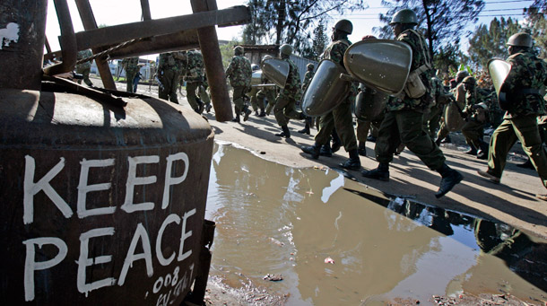 Police officers patrol Kibera slum in Nairobi,  Kenya. (AP/Darko Bandic)
