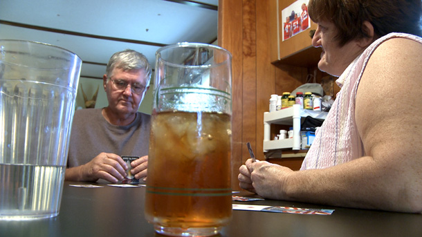 John and Delynn Gibel have no health insurance offered through their jobs, and no money to purchase coverage on their own. A year's worth of tests and treatments left the family with $30,000 in medical bills; the only option was to declare bankruptcy. (AP/Matt York)