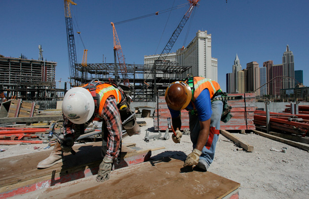 Two carpenters  drive nails at the construction site of CityCenter in Las Vegas, which purports to be the largest privately funded "green" development in the country. (AP/Jae C. Hong)