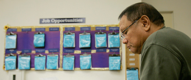 Vic Toribio of Alameda, California, reads a job listing at the One-Stop Career Center Friday in Oakland.
<br /> (AP/Ben Margot)
