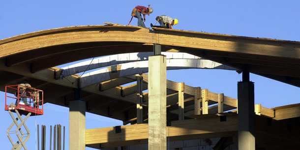Construction workers put down the top floor ceiling on the Department of Natural Resources' green building in Jefferson City, MO. Investments in efficient green buildings would create jobs, lower emissions, and use less energy. (AP/Kelley McCall)