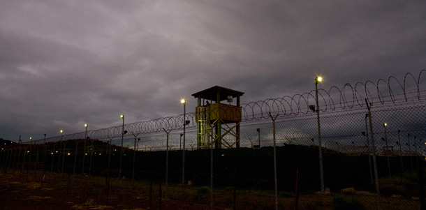 A guard sits in a tower overlooking the Guantanamo detention facility on the U.S. Naval Base in Guantanamo Bay, Cuba. (AP/Brennan Linsley)