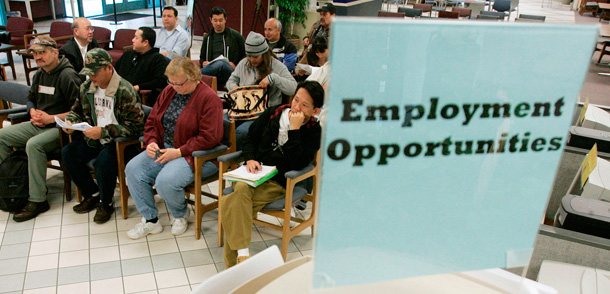 People wait to talk to unemployment benefits staff at an Employment Development Department office in San Jose, California. The number of people receiving unemployment benefits has reached an all-time record. (AP/Marcio Jose Sanchez)