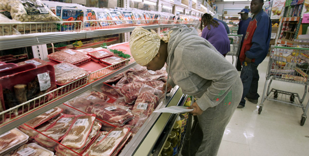 Tamika Ealy, a food stamps recipient, looks over the meat section at a grocery store in Detroit, Michigan. Food stamps help reduce food insecurity and hunger, and according to the USDA, they also create 16,400 private sector jobs for every $1 billion invested. (AP/Carlos Osorio)