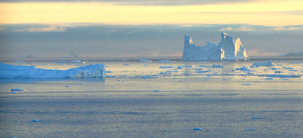 An iceberg is seen in Disko Bay, Greenland, above the Arctic Circle. The American press, hampered by budget constraints and other concerns, has taken a shortsighted approach to the so-called climate policy beat. (AP/John McConnico)