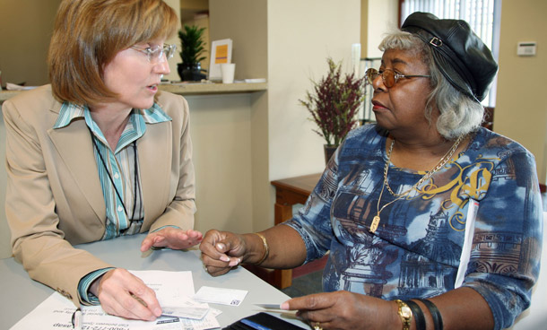 A Medicare recipient receives advice from a representative from the Federal Centers for Medicare and Medicaid Services. (AP/David Zalubowski)