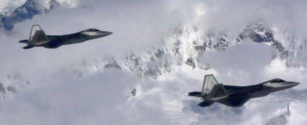 The military currently has 183 F-22 Raptors. Here, two of them fly over Denali in Alaska. (AP/Mark Farmer)