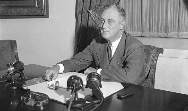 President Franklin D. Roosevelt is shown at his desk at the White House when he outlined his ideas to the nation on a partnership between the government and agriculture, industry, and transportation. (AP)