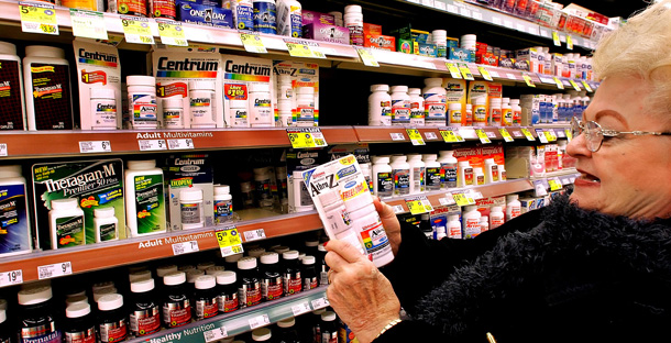 Medicare recipient JoAnn Coffman shops for vitamins at her local drug store. (AP/Seth Perlman)