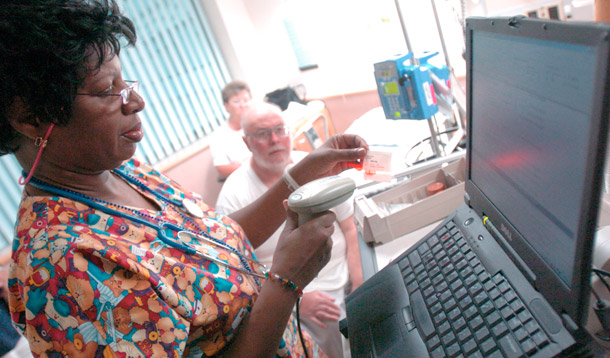 A nurse at the Veterans Affairs Medical Center in Baltimore uses state of the art technology to scan a barcode before dispensing medicine. (AP/Don Wright)