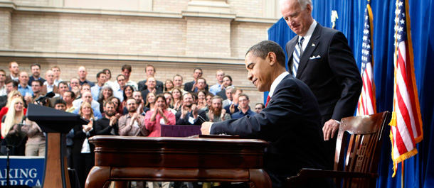 Vice President Joe Biden looks on as President Barack Obama signs the American Recovery and Reinvestment Act. (AP/Gerald Herbert)