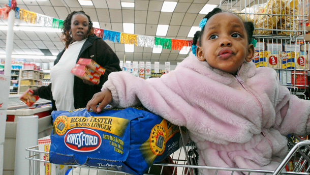 Lynda Wheeler shops with her daughter shortly after midnight on the first of the month when her family's new food stamps are available from the Supplemental Nutrition Assistance Program.
<br /> (AP/Paul Beaty)