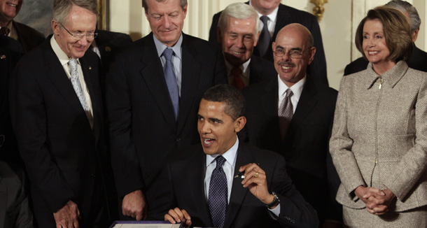 President Barack Obama signs the CHIP legislation in the East Room of the White House on February 4, 2009. (AP/Evan Vucci)