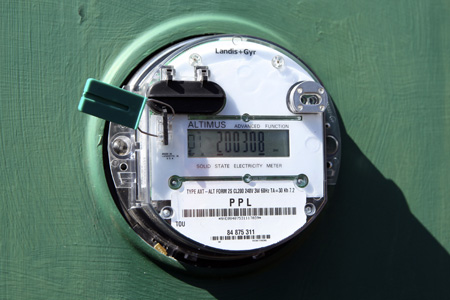 A smart meter is seen at a home in Elizabethtown, PA. A national clean-energy smart grid would use new digital technology in individual homes and businesses while also allowing for the expansion of renewable energy. (AP/Carolyn Kaster)