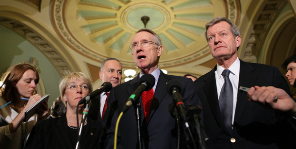 Senate Majority Leader Sen. Harry Reid (D-NV), center, talks about the Senate's work on the economic stimulus bill on February 6, 2009. The Senate compromise stimulus would create between 430,000 and 538,000 fewer jobs than the House-passed bill. (AP/J. Scott Applewhite)