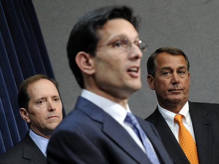 John Boehner (R-OH), right, and Rep. Dave Camp (R-MI), left, listen as Eric Cantor (R-VA) speaks during a news conference on Capitol Hill. Conservatives opposed to the Obama administration’s recovery policies ignore the fundamentals of market economics. (AP/Susan Walsh)