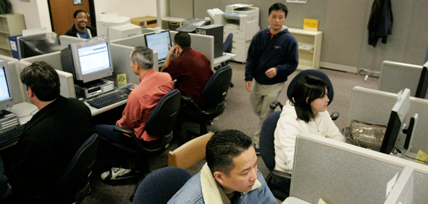 People looks for jobs in front of computer screens at the California Employment Development Department in Sunnyvale, CA, on January 6, 2009. The massive economic crisis  the nation faces was brought on by conservatives’ laissez-faire economic philosophy that ran amok. (AP/Marcio Jose Sanchez)