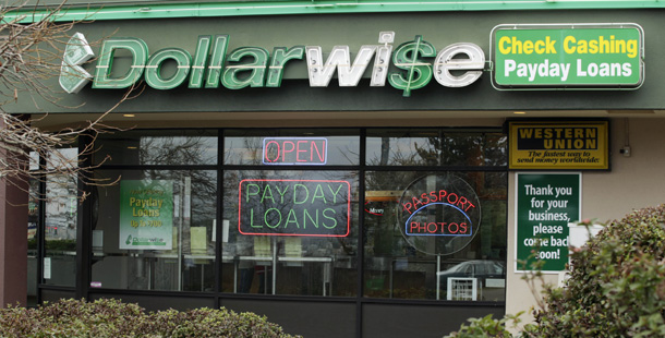 A Dollarwise payday loan store is seen in Kent, WA. Payday loans end up being very costly for low-income and minority families in particular, making restrictions on these loans imperative along with more availability of other low-cost credit options. (AP/Ted S. Warren)
