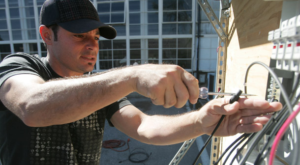 Duane Robinson install wires during a class on solar panel installation on March 28, 2009 at San Jose City College in San Jose, CA. Green jobs encompass the full range of skill sets and pay scales, and the majority are good-paying, middle-skill jobs accessible to all Americans. (AP/Mathew Sumner)
