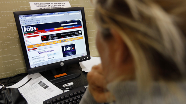 Cheryl Fellows of Germantown, MD, searches for jobs on a computer at the Germantown Public Library. Employers shed 663,000 jobs in March—the third largest one-month fall in employment since 1949. (AP/Jacquelyn Martin)