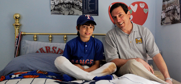 Stay-at-home dad Bob Hurley poses with his son Conner. Hurley decided to stay home with his boys seven years ago when his wife had a better job opportunity.