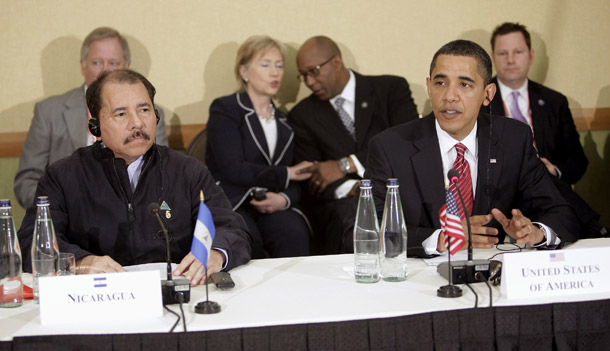 Nicaragua's President Daniel Ortega, left, looks on as President Barack Obama makes a statement at the Summit of the Americas on April 19, 2009. (AP/Evan Vucci)